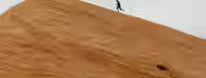 Climbing the Summit of Self-Discovery A lone climber scaling a steep, barren slope, symbolizing the challenging journey towards leadership and self-improvement.