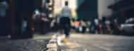 Journey on the Path to Leadership A lone figure walks a blurred path amidst the bustling city, symbolizing the journey of an emerging leader finding clarity in chaos.