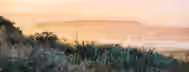Sunrise Over Mountains: Path to Leadership A serene sunrise over misty hills symbolizing the dawn of new opportunities and personal growth on the path to leadership.
