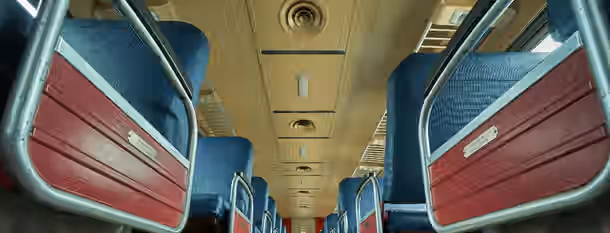 Embarking on the Path to Leadership Growth Empty train seats symbolize the journey of self-discovery and growth, navigating through experiences to emerge as a leader.