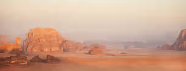 Rising Through the Desert: A Leader’s Odyssey Rising sun illuminating ancient desert rocks, symbolizing the emerging leader's journey through vast challenges toward self-improvement.