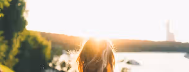 Dawn of Leadership: Embracing a New Beginning A lone figure gazes at a sunrise, symbolizing a leader's journey towards newfound purpose and personal growth.
