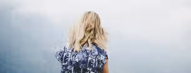 Facing Horizons: Journey to Self-Discovery Standing at the edge of a misty horizon, a figure contemplates the vast journey ahead toward self-discovery and leadership.