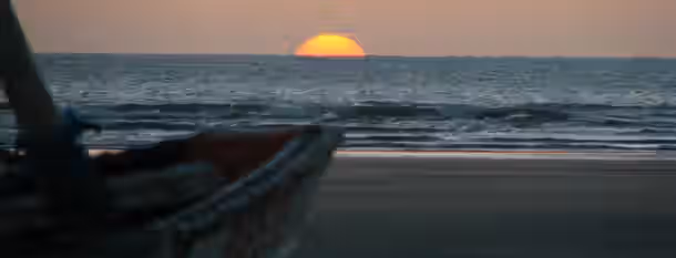 Sunrise Voyage: The Path of Emerging Leadership A rising sun over a calm sea symbolizes the dawn of new opportunities in self-improvement and leadership growth.