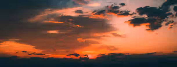 Sunrise of Potential: A Leader’s New Dawn A vibrant sunrise breaking through clouds, symbolizing an emerging leader's journey to self-improvement and newfound potential.