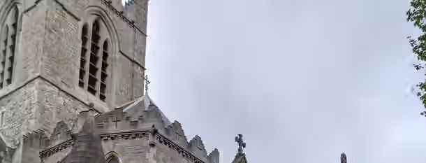 Rising Above Challenges: The Leader's Ascent A towering stone cathedral reaching skyward symbolizes an emerging leader striving for personal growth and self-discovery.