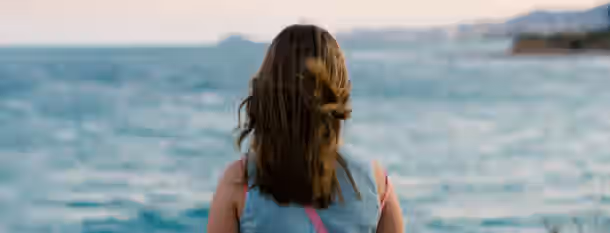 Embracing Horizons: A Leader's Journey of Growth A seeker gazes at the vast ocean, embodying the journey of an emerging leader embarking on the path of self-improvement.