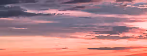 Dawn of a Leader's Journey A dawn sky of pink and purple hues symbolizes the emerging leader’s journey to self-improvement and new beginnings.