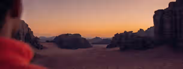 Sunrise Over Unknown Paths Gazing at a dawn-colored desert, symbolizing an emerging leader’s path through challenges towards enlightenment and self-improvement.