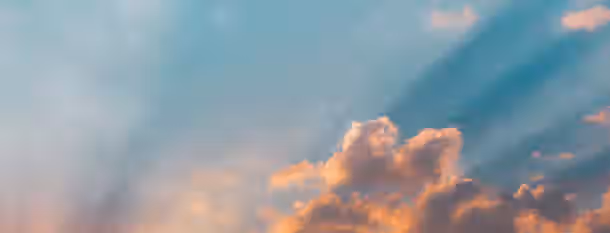 Rays of Potential: Dawn of Leadership Transformation Golden light breaking through clouds symbolizes an emerging leader's journey to self-improvement and clarity.