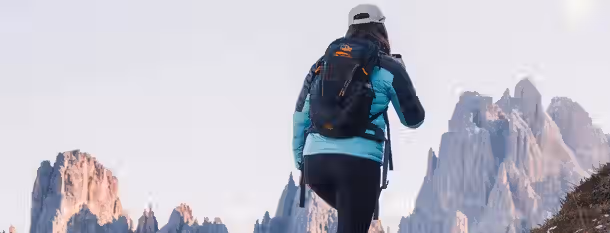 Ascending Peaks: A Leader's Path to Growth A climber ascends rocky peaks, symbolizing a leader’s journey through challenges towards growth and self-improvement.